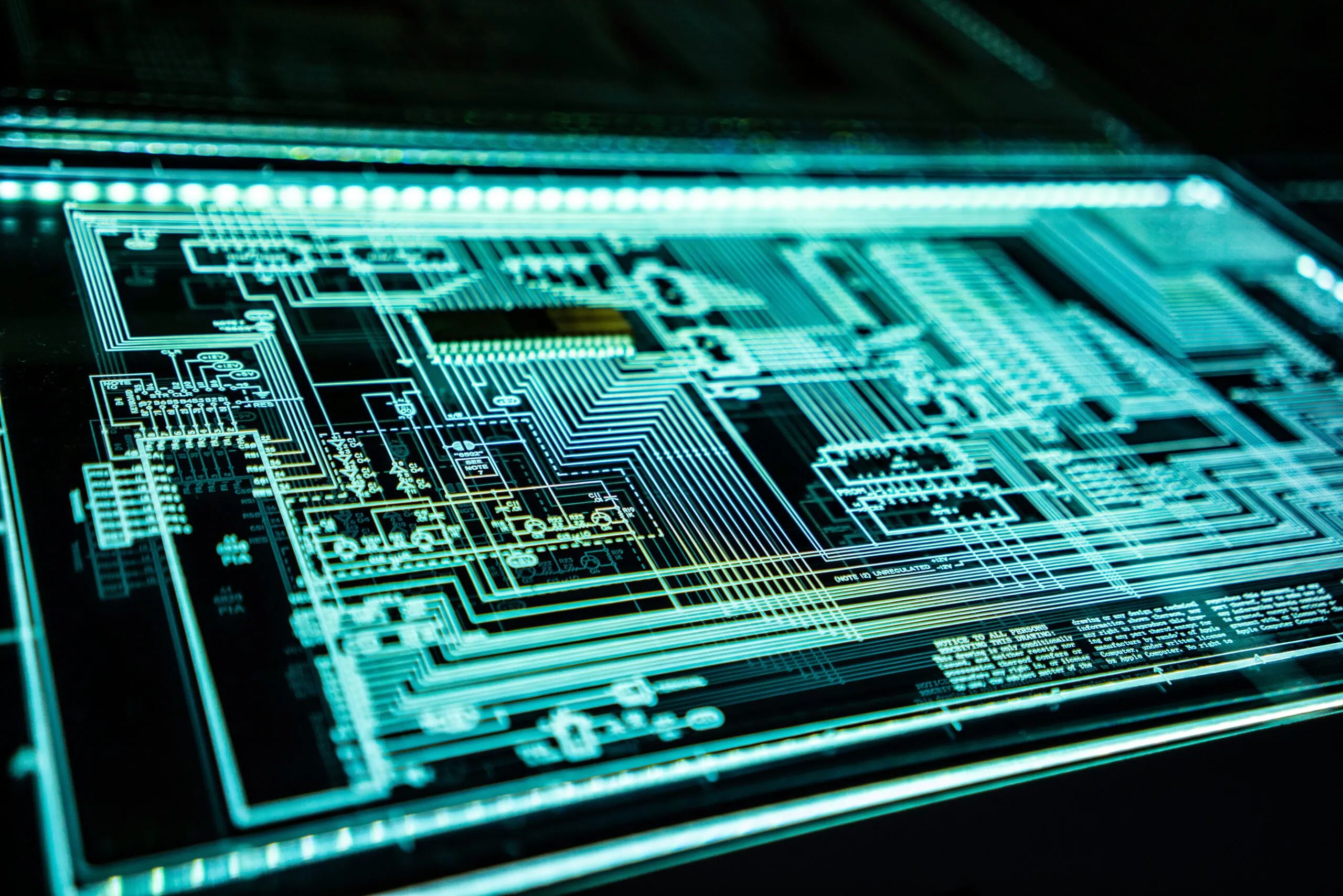 A close up view of a glowing electronic component board.