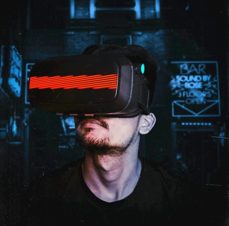 Young man immersed in a virtual reality experience using a VR headset, showcasing futuristic tech in a gaming environment.